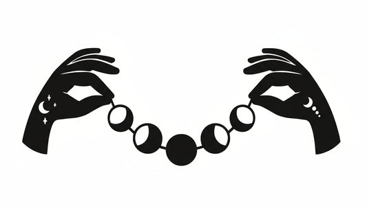 Black silhouette of hands holding a bracelet with moon phases on a white background
